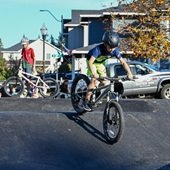 Kid riding a bike on the pump track.