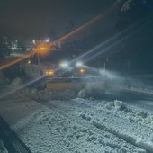 A City truck plowing snow.