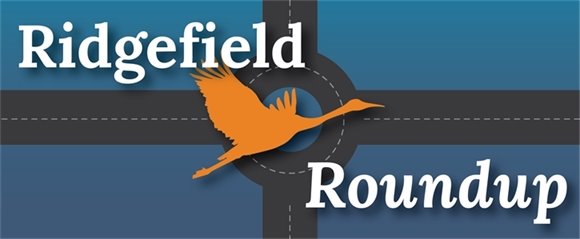 A roundabout with a sandhill crane and the text 'Ridgefield Round-Up'