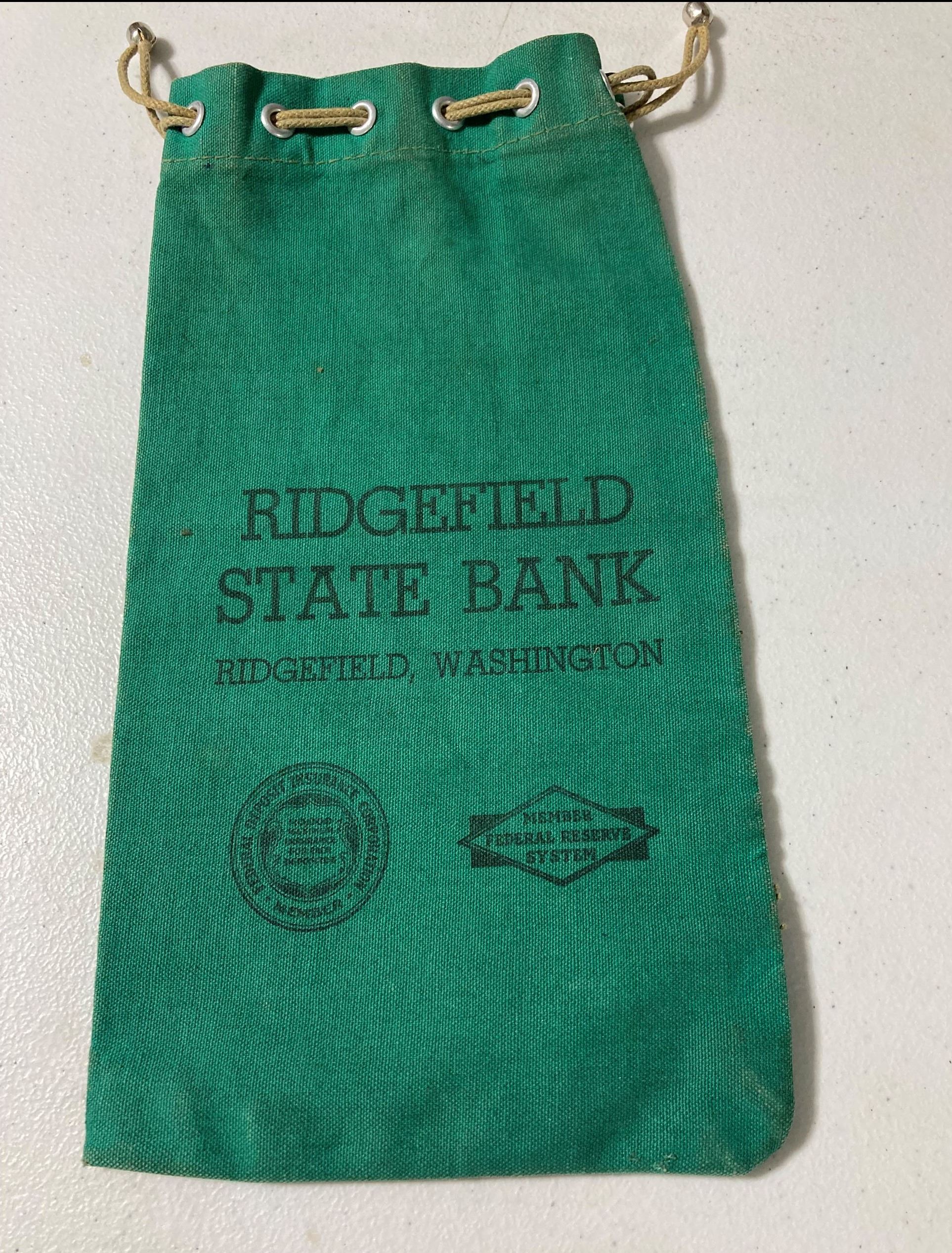 Green cash bag with the words 'Ridgefield State Bank.'