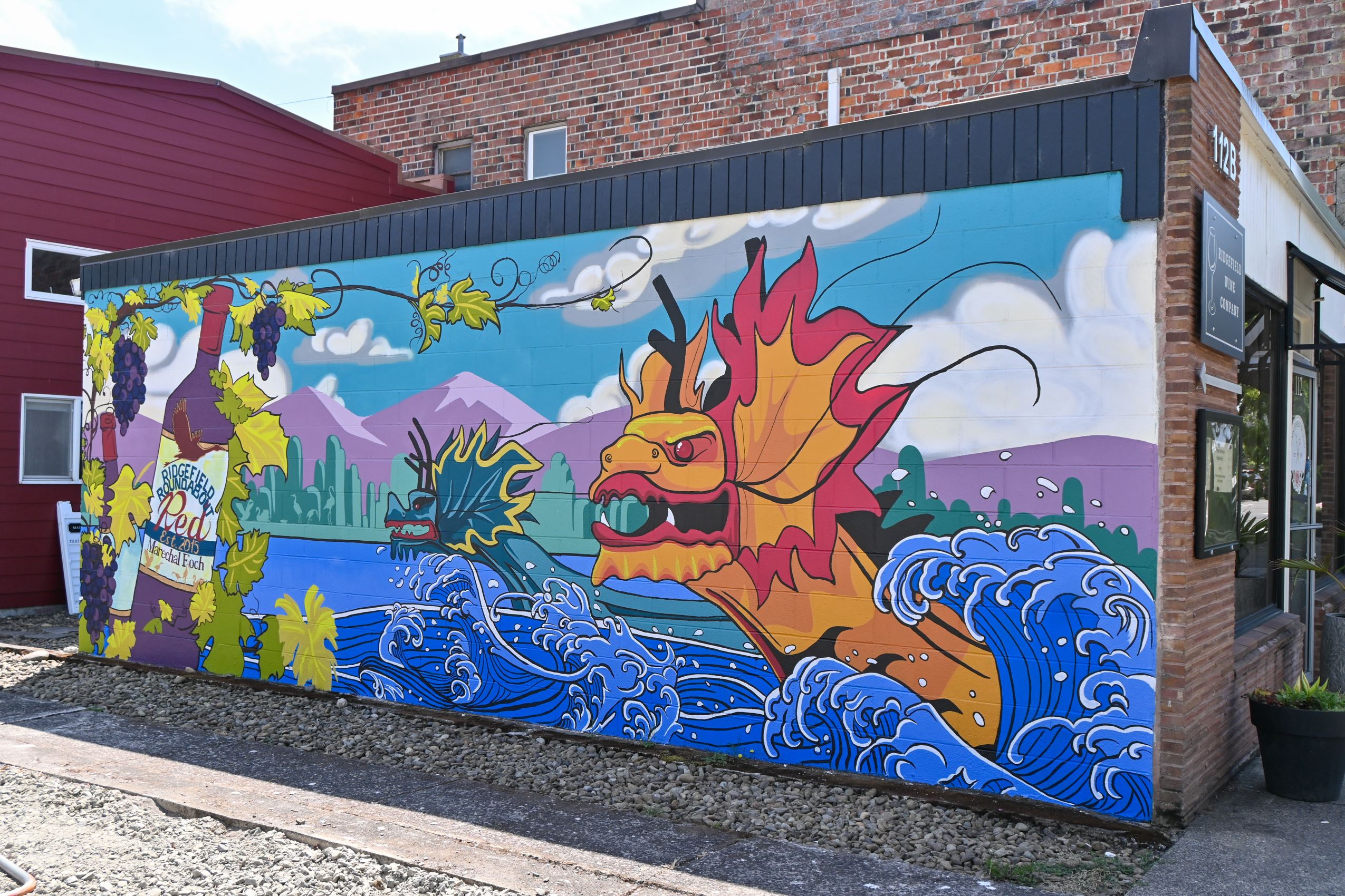 A freshly painted mural on the side of a building.