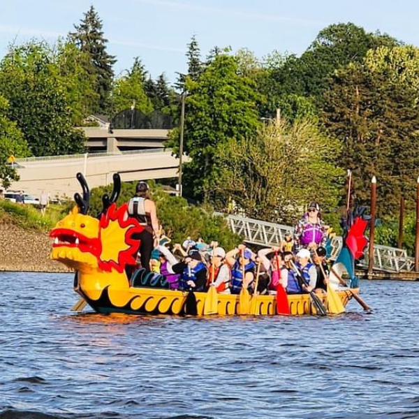 Paddlers on the Kaohsiung Dragon Boat on Lake River near the boat launch.