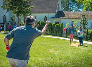 Man Throwing a Bean Bag