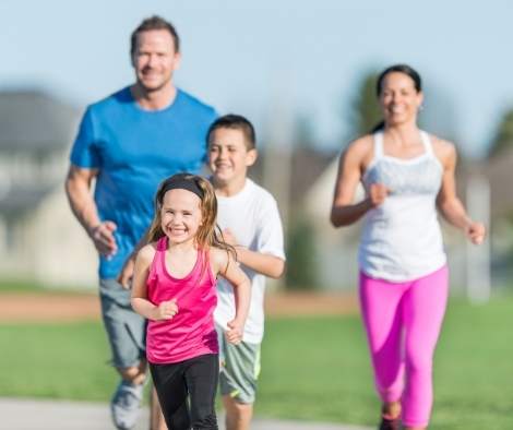 Family of Four Jogging Together